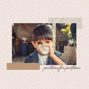 A young boy drinking a glass of milk.