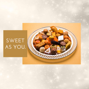 A platter of various colorful Indian sweets with the text 'Sweet as You'.