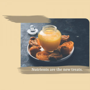 A plate of traditional Indian sweets with a glass of orange juice, promoting healthy nutrients.