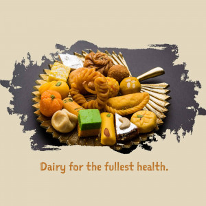 A colorful platter of various Indian sweets and desserts.