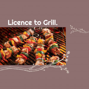 Close-up of grilled kebabs with colorful vegetables on a grill.