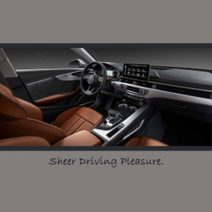 Interior view of a brown leather Audi A4 dashboard and seats with a digital display.