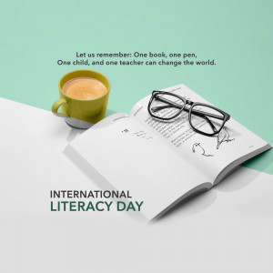 A cup of coffee, glasses, and an open book with the text 'International Literacy Day'