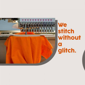 Close-up of an embroidery machine stitching on an orange t-shirt with text 'We stitch without a glitch'.