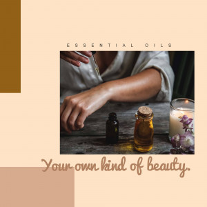 Close-up of hands applying essential oil to wrist with bottles and candle in background