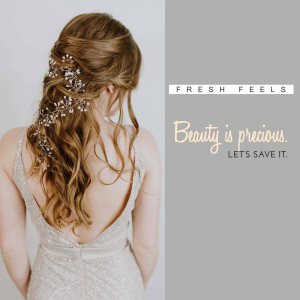 Woman with intricate hair accessories and a low back dress