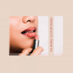 Close-up of a woman applying pink lipstick