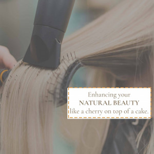 A person blow-drying long blonde hair with a round brush.