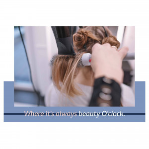 A person getting their hair styled with a hair dryer and round brush.