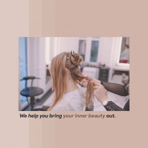 A hairstylist working on a client's hair in a salon.