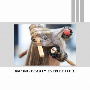 Close-up of a woman getting her hair styled with wooden rollers.