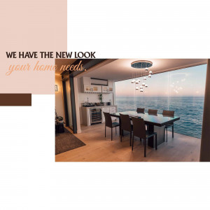 A modern kitchen and dining area with a large window overlooking the ocean.