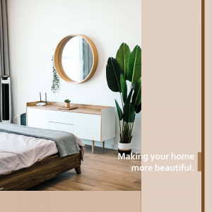 A minimalist bedroom with a round mirror, wooden furniture, and a large plant.