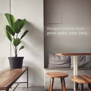 A minimalist interior scene featuring a green plant in a pot, wooden furniture, and a neutral color palette.