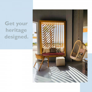 Interior view of a modern living space with a wooden seating area and hanging chair.