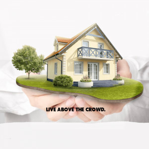 A house held in a pair of hands with the text 'Live Above The Crowd'