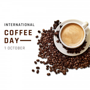 A cup of coffee with coffee beans and text 'International Coffee Day - 1 October'