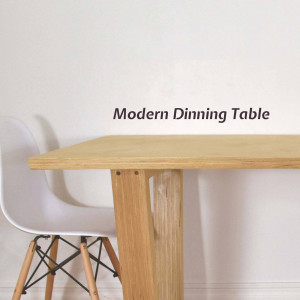 A light wood dining table with a white chair.