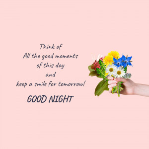Hand holding a bouquet of colorful flowers with a 'Good Night' message.