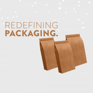Two brown paper bags with the text 'Redefining Packaging'