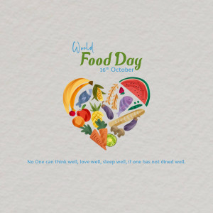 Heart-shaped arrangement of fruits and vegetables with 'World Food Day' text