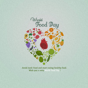 A heart-shaped collage of fruits and vegetables with the text 'World Food Day'.