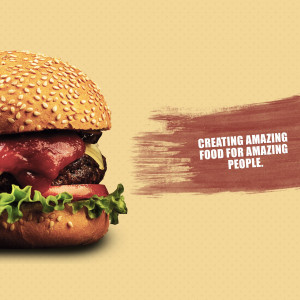 Close-up of a juicy burger with sesame seed bun and fresh ingredients