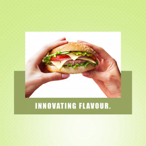 A hand holding a juicy cheeseburger with fresh ingredients.