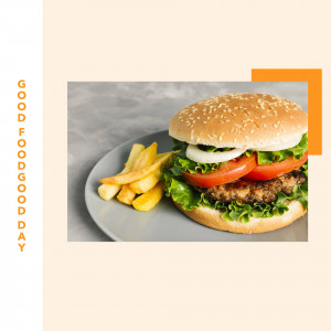 A close-up of a juicy burger with french fries on a plate.