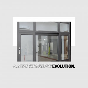 Close-up of a modern gray sliding glass door with a white frame and reflective glass.