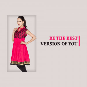 Woman wearing a pink kurti with black embroidery and a motivational quote.