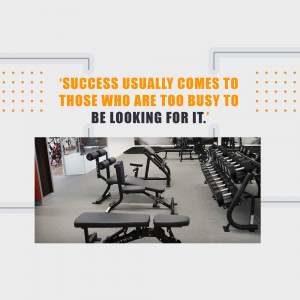 Motivational quote about success and hard work displayed over a gym interior.