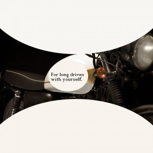 Close-up of a Royal Enfield motorcycle with a text bubble