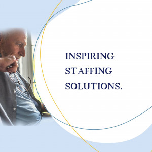 Man working on laptop with text 'Inspiring Staffing Solutions'