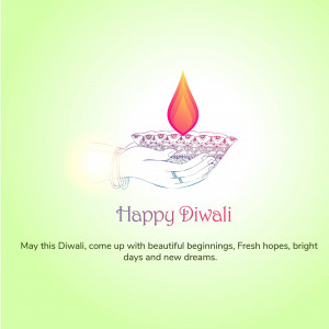 Diwali lamp on a hand with a festive greeting