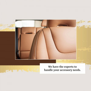 Close-up of a luxurious car seat with brown leather and perforated detailing.