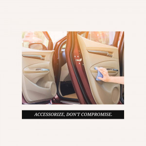 Close-up of a hand cleaning the interior door panel of a car