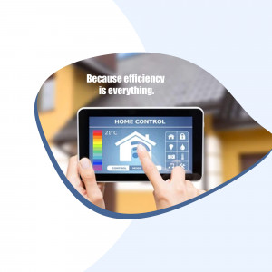 Hand holding a tablet displaying a smart home control interface.