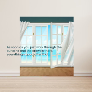 Open curtains revealing a bright blue sky and beach scene