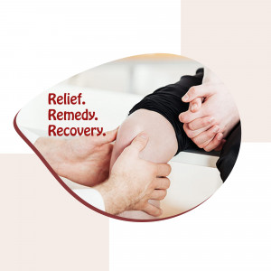 Hands providing support and massage to a knee, symbolizing pain relief and recovery.