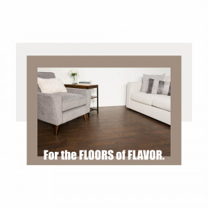 Modern living room interior with a gray armchair, white sofa, and dark wood flooring.