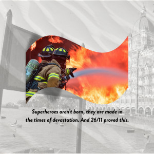 Two firefighters battling a blaze with a city skyline in the background.