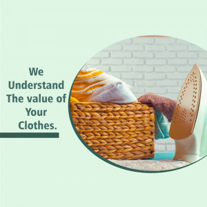 Wicker basket filled with clean laundry and an iron on a reflective surface.