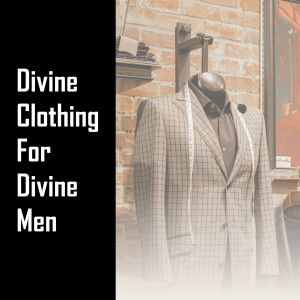 A mannequin wearing a grey checkered suit in a clothing store.