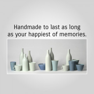 Assortment of handmade ceramic vases and cups in shades of blue, gray, and white.