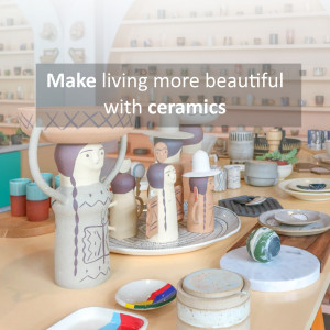 A colorful display of handmade ceramic art in a pottery shop.
