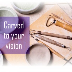 Pottery tools and clay on a workbench with text 'Carved to your vision'