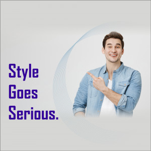 A young man in a denim shirt pointing to the side with a confident smile.