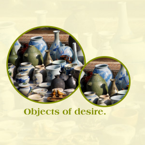 A collection of antique ceramic vases and pots displayed in a market setting.