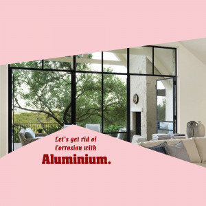 Modern home interior with large aluminum framed windows and doors, showcasing corrosion resistance.